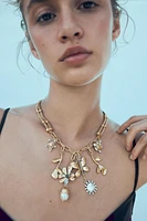 COLLIER EN MATIÈRES VARIÉES CHARMS PAPILLON