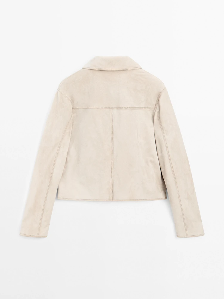 Veste courte à surpiqûres en cuir finition daim