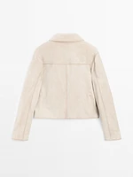 Veste courte à surpiqûres en cuir finition daim