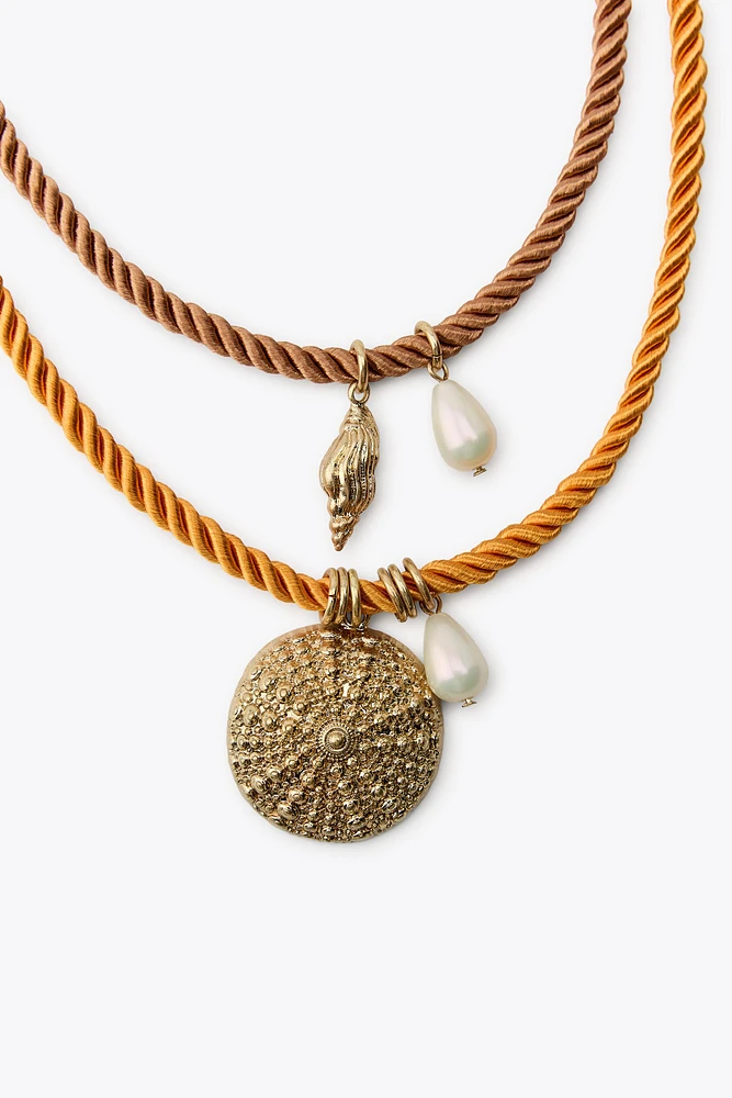 PACK OF 4 ROPE NECKLACES WITH MARINE CHARMS
