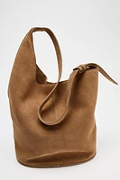 SAC SEAU SOFT ASYMÉTRIQUE EN CROÛTE DE CUIR