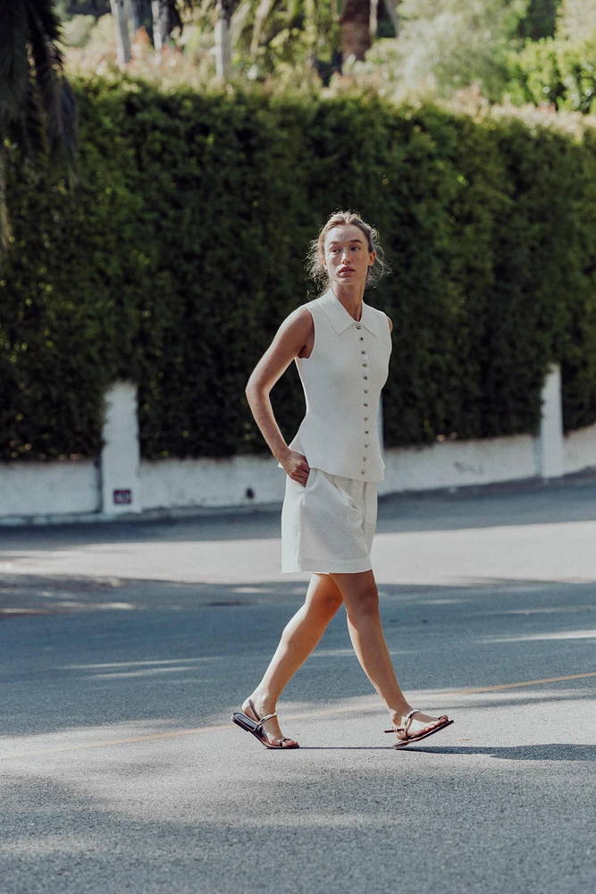 TOP GILET EN MAILLE PÉPLUM