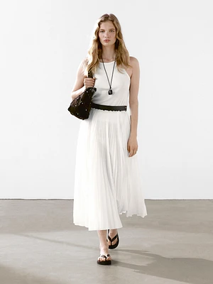 Pleated skirt with leather detail