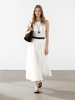 Pleated skirt with leather detail