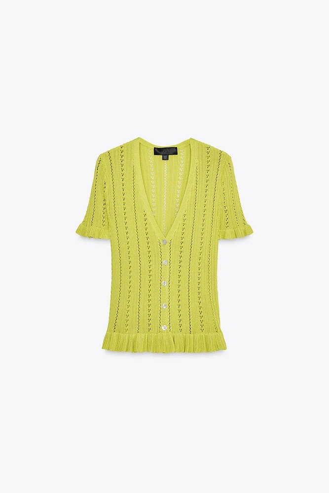 GILET EN MAILLE POINTELLE À VOLANTS
