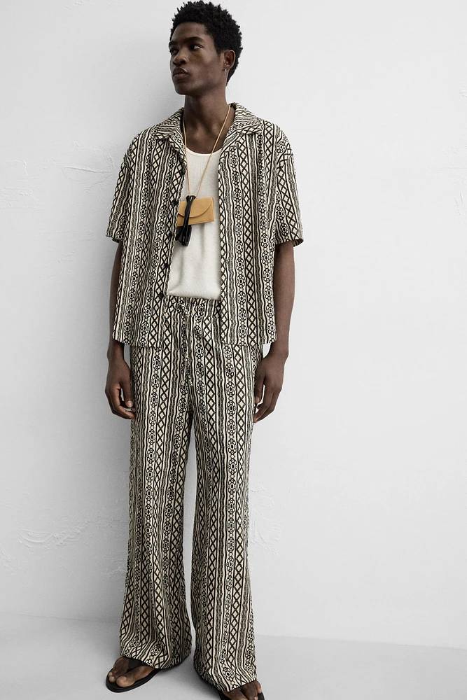 PERFORATED JACQUARD RELAXED FIT PANTS