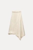 ASYMMETRIC FRINGE SKIRT