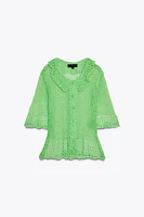GILET EN MAILLE OUVERT MANCHES COURTES