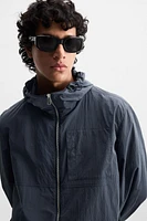 HOODED TECHNICAL JACKET