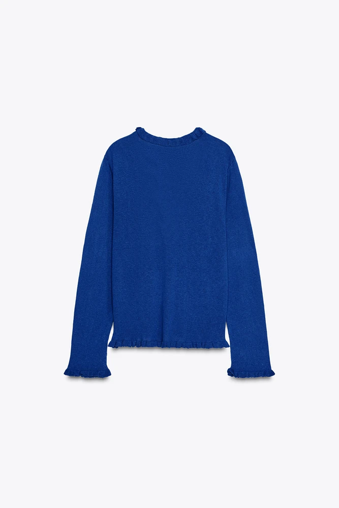 GILET EN MAILLE À VOLANTS