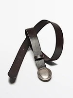Leather belt with oval plate buckle