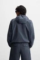HOODED TECHNICAL JACKET