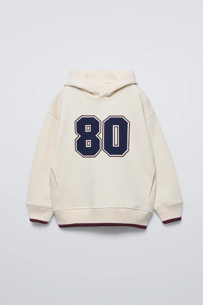 NUMBER VARSITY SWEATSHIRT