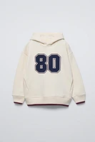 NUMBER VARSITY SWEATSHIRT