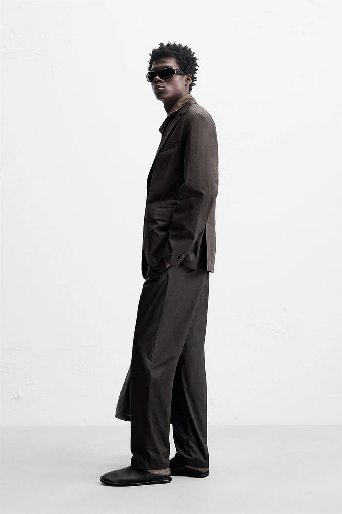 WAXED EFFECT SUIT PANTS