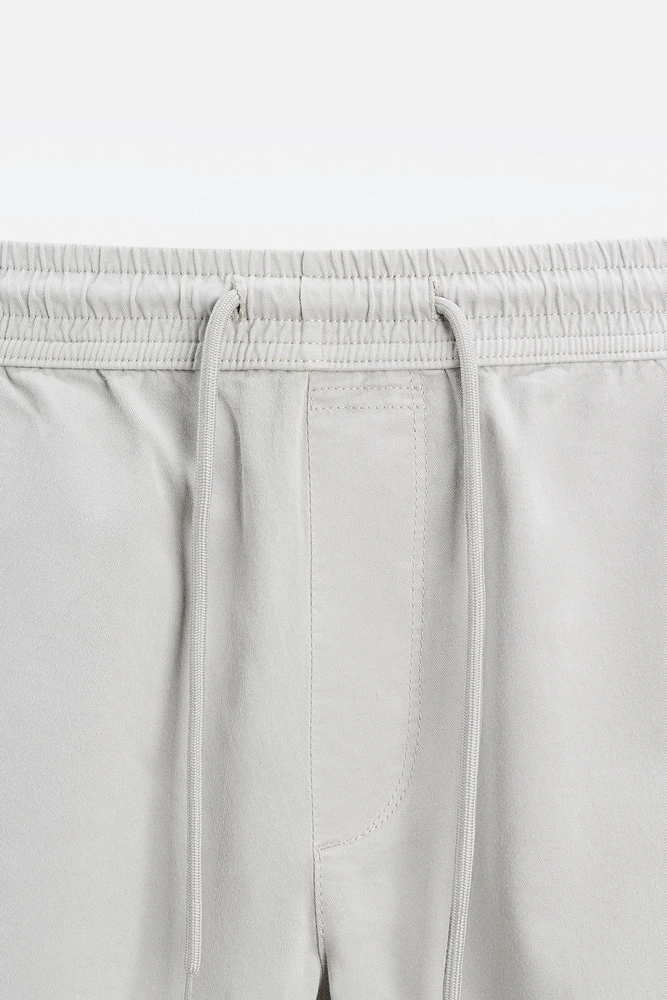 PANTALON DÉLAVÉ AVEC TAILLE JOGGING