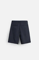RELAXED FIT PLEATED SHORTS