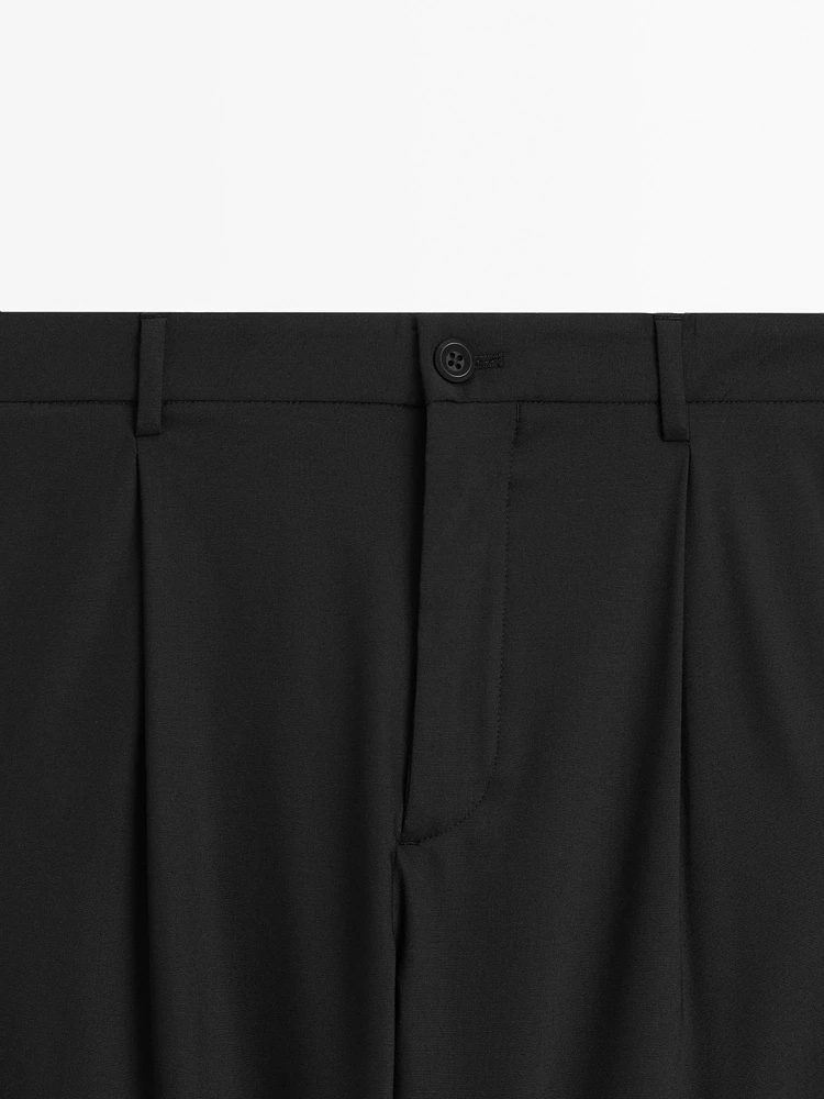 Relaxed fit trousers with darts