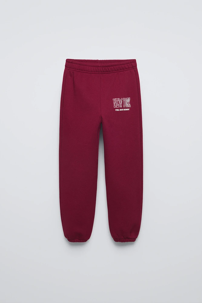 FLOCKED TEXT JOGGING PANTS