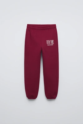 FLOCKED TEXT JOGGING PANTS