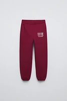 FLOCKED TEXT JOGGING PANTS