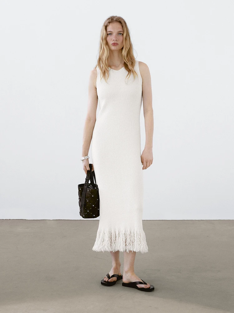 Knit dress with fringed hem