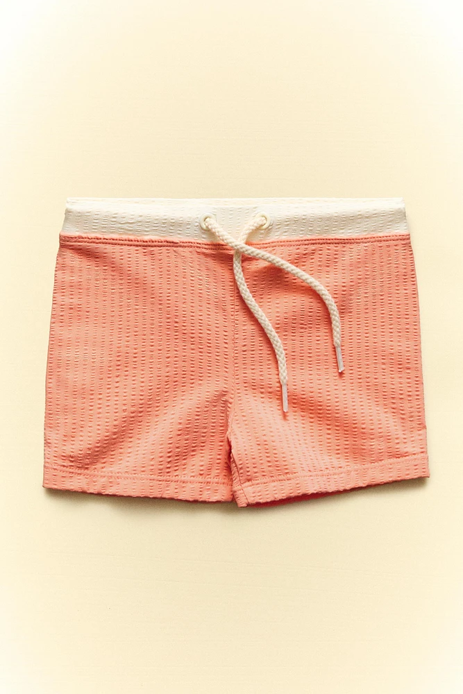 MAILLOT DE BAIN PLAGE ENFANT COULEUR CONTRASTANTE