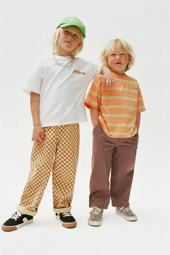 PANTALON EN SERGÉ À CARREAUX DAMIER
