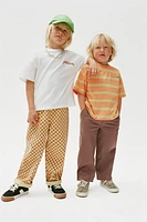 PANTALON EN SERGÉ À CARREAUX DAMIER