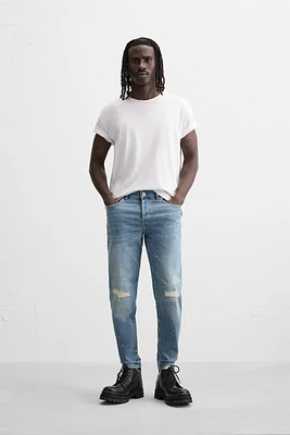 JEANS SKINNY AVEC DÉCHIRURES ET ÉCLABOUSSURES