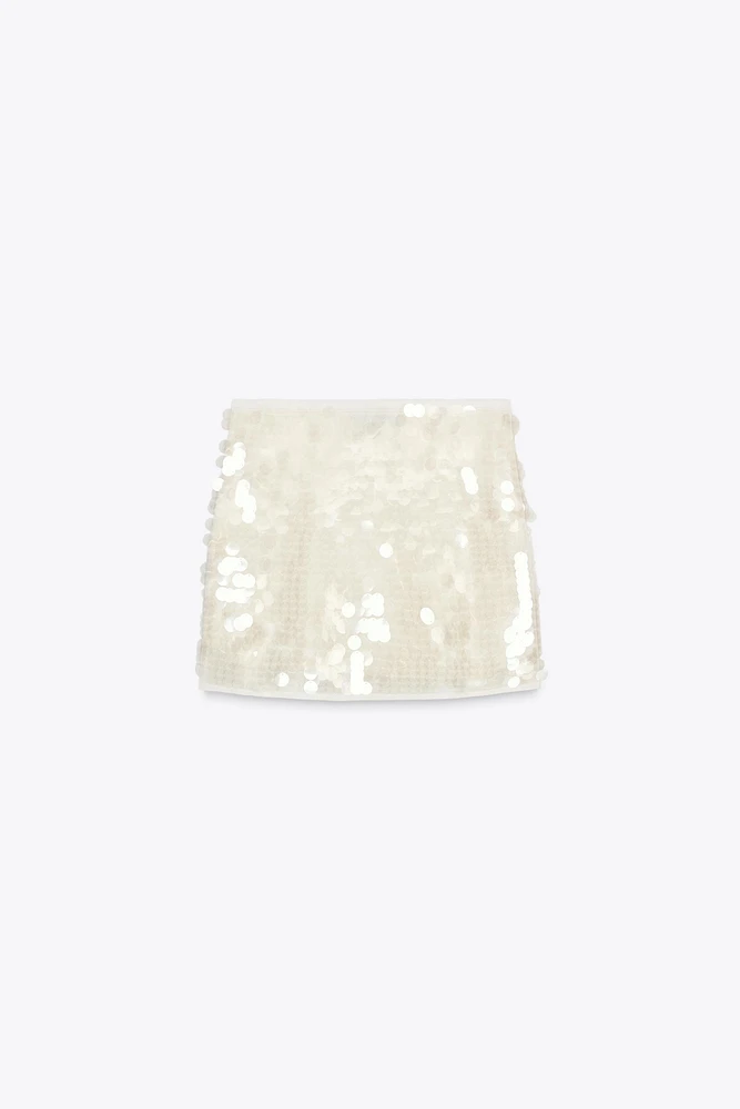 MINI-JUPE EN MAILLE À SEQUINS
