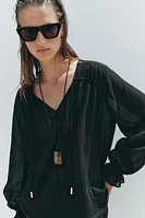 BLOUSE SEMI-TRANSPARENTE