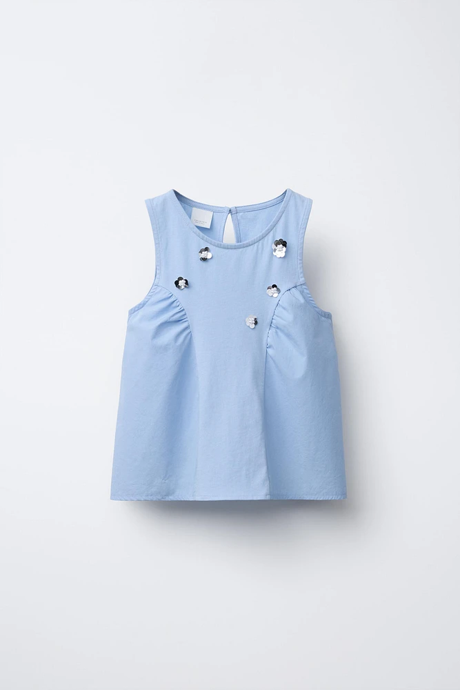T-SHIRT EN MATIÈRES VARIÉES À FLEURS