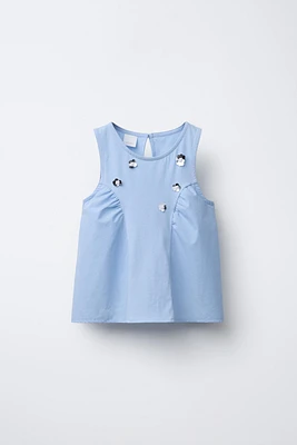 T-SHIRT EN MATIÈRES VARIÉES À FLEURS