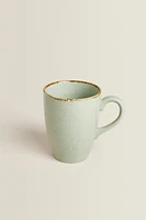 PORCELAIN MUG WITH ANTIQUE FINISH RIM