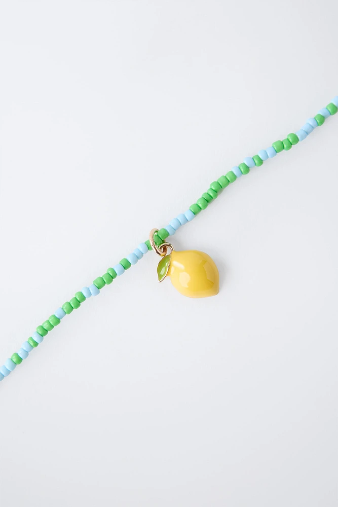 LOT DE DEUX COLLIERS TOMATE ET CITRON