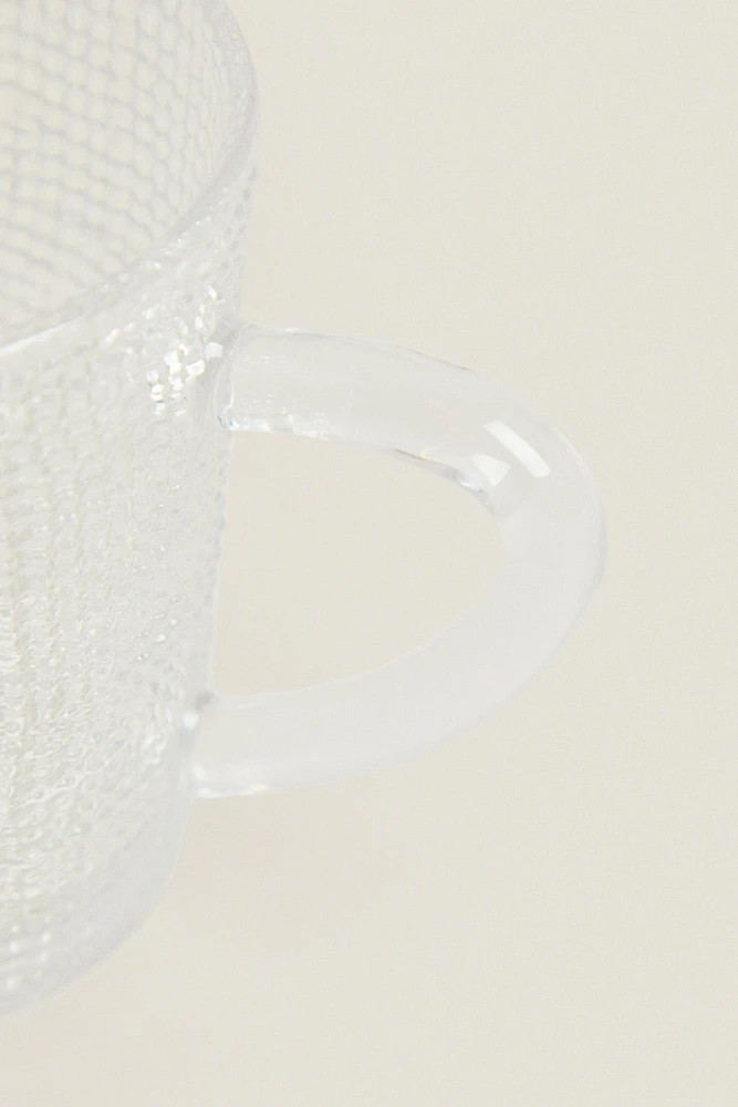 GLASS CUP WITH RAISED DESIGN