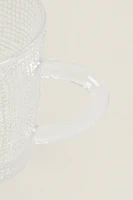 GLASS CUP WITH RAISED DESIGN