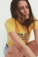 T-SHIRT DÉLAVÉ AVEC INSCRIPTION