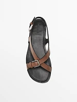 Flat leather sandals with buckles
