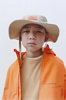 VESTE LÉGÈRE À CAPUCHE DÉPERLANTE