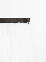 Pleated skirt with leather detail