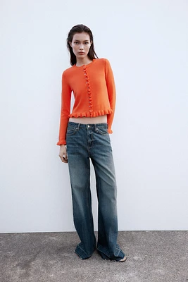 GILET EN MAILLE À VOLANTS
