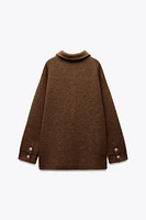 GILET EN MAILLE À BOUTON DORÉ