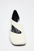 ASYMMETRIC LEATHER HEELS