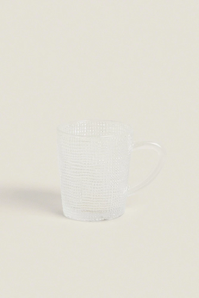 GLASS CUP WITH RAISED DESIGN