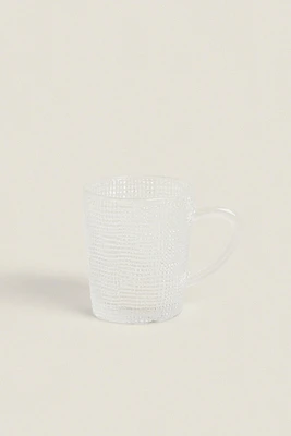 GLASS CUP WITH RAISED DESIGN