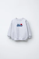 "ALL AMOR" FLOCKED TEXT SWEATSHIRT