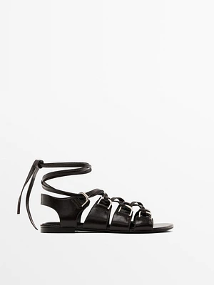 Lace-up sandals with rings