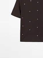 Oversized T-shirt with eyelets